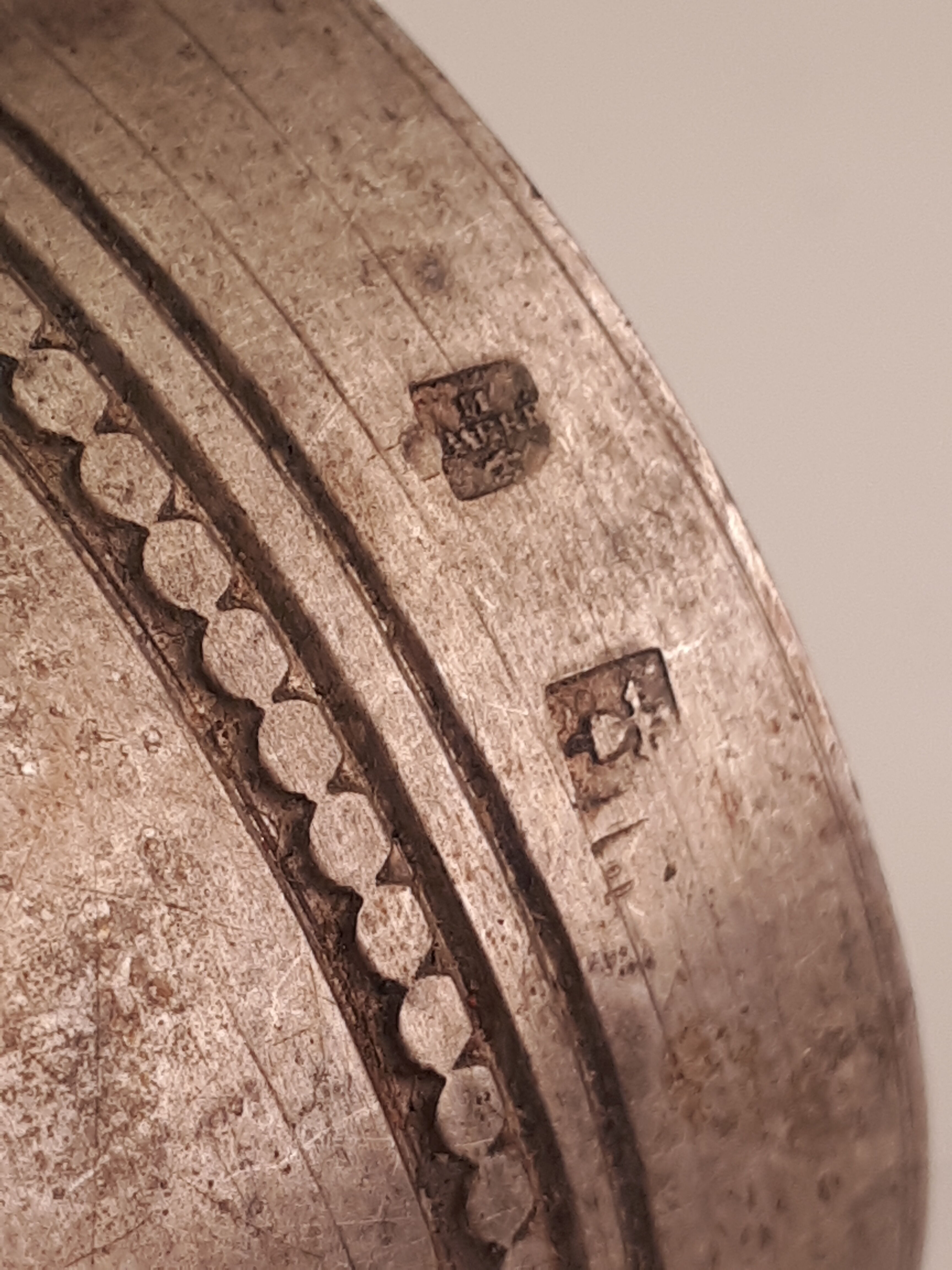 Round old silver metal towel