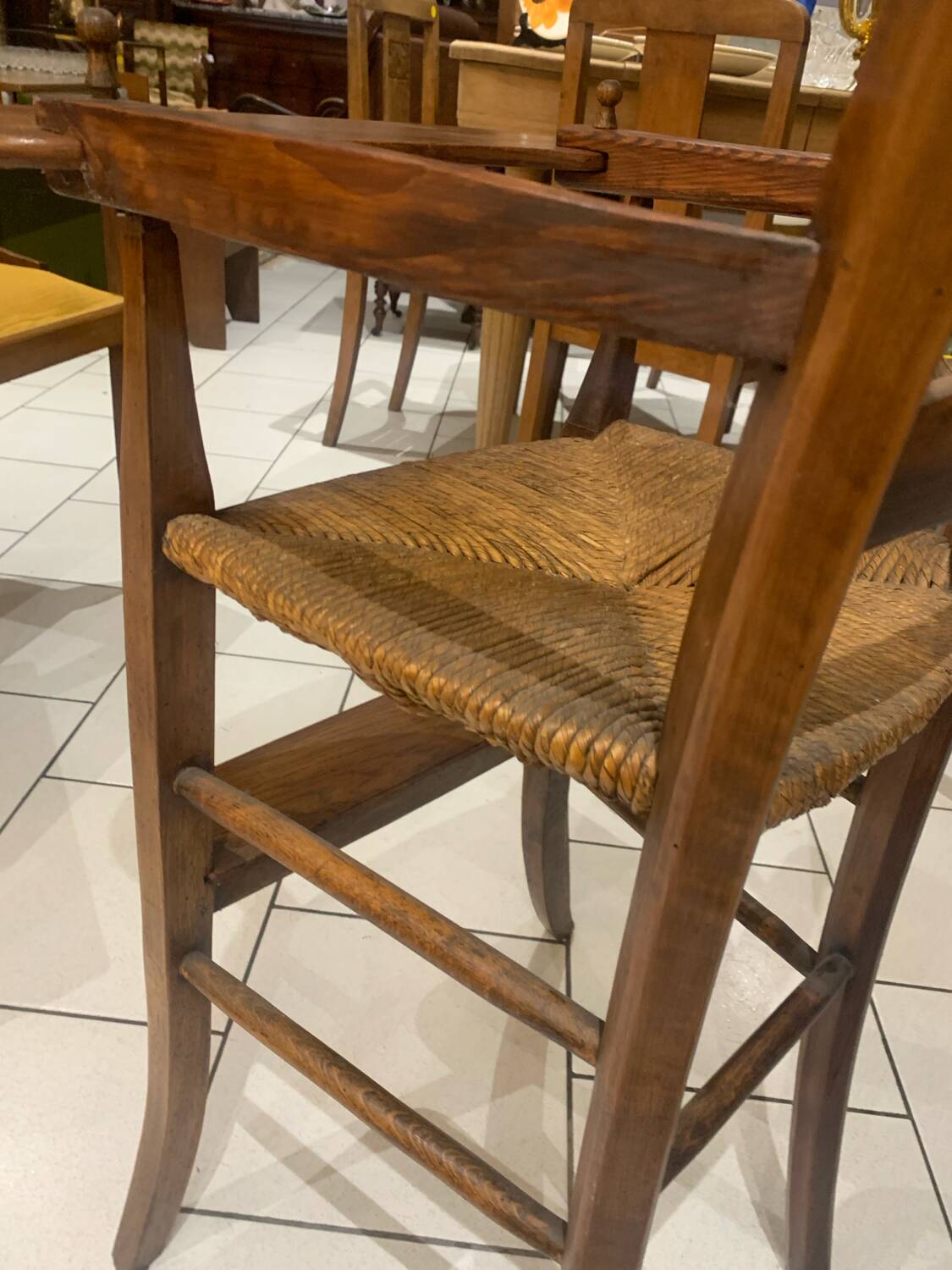 Antique straw-covered high chair