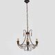 Vintage 4-arm, 4-light chandelier from the 1980s. Brown and gold metal.
