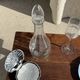 Vintage silver-plated shell butter dish with transparent bowl.