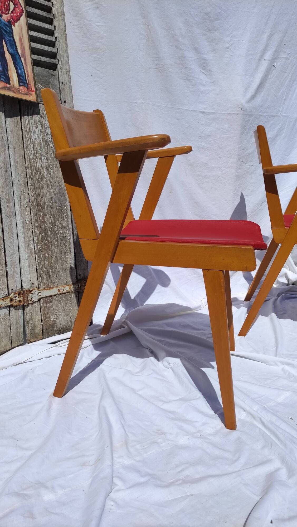 Pair of wooden armchairs and skaï foot compass of the 50s