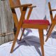 Pair of wooden armchairs and skaï foot compass of the 50s