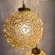 Suspension cascade trois feux globes vintage en verre ambré