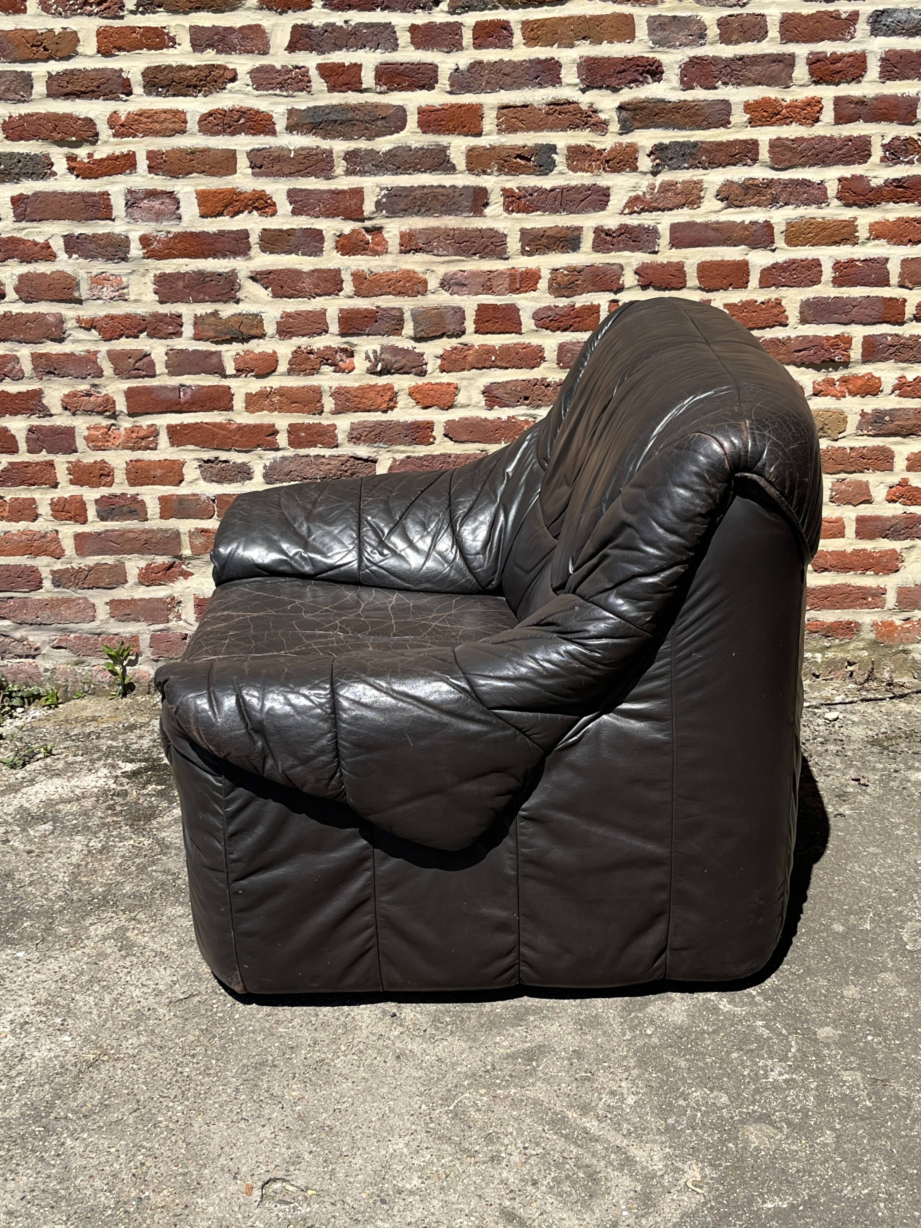 Pair of patinated leather club armchairs
