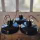 Trio of suspensions in enamelled sheet metal