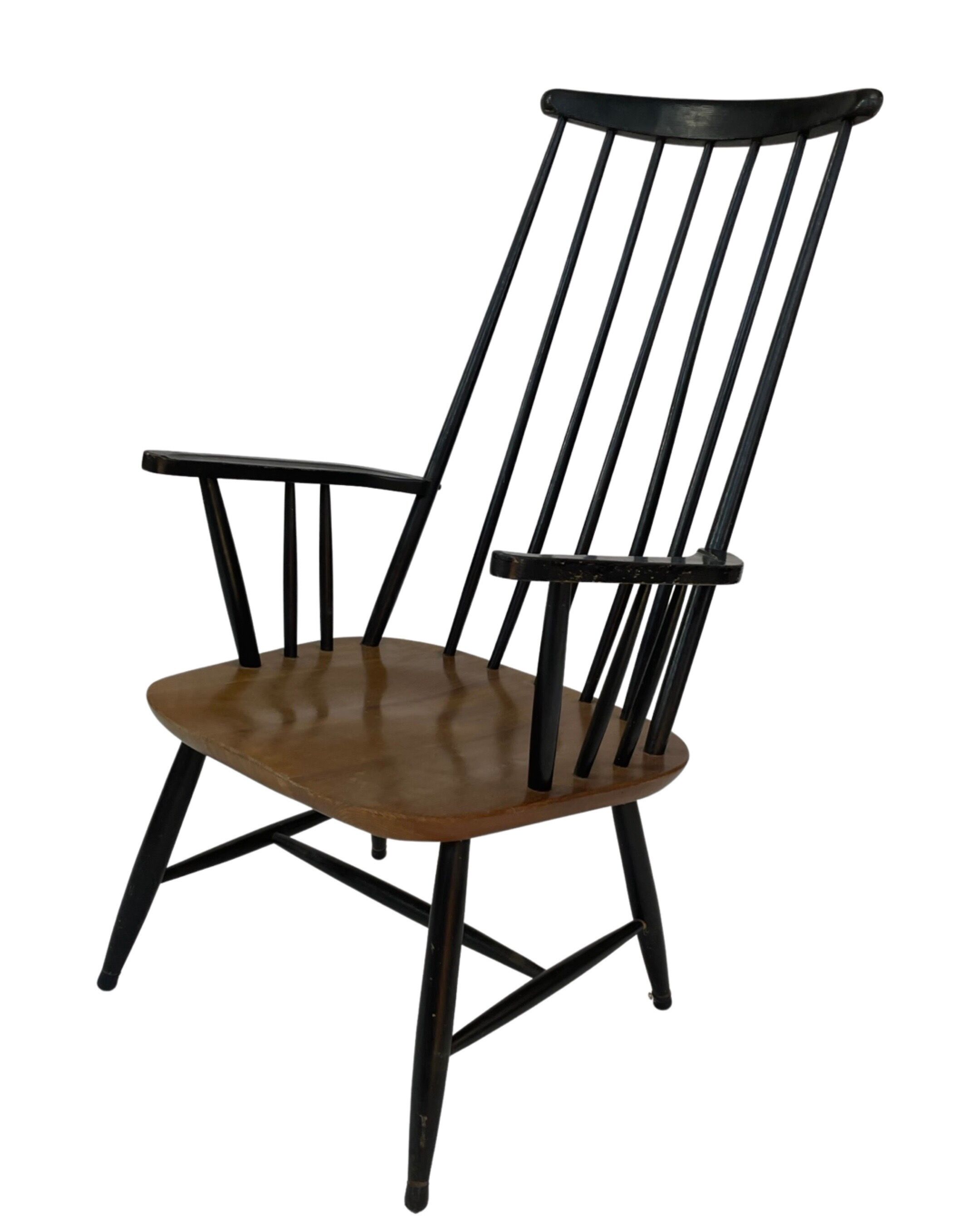 Vintage easy chair with high back and armrest from the 60s