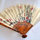 Vintage bamboo fan with floral decoration from China.
