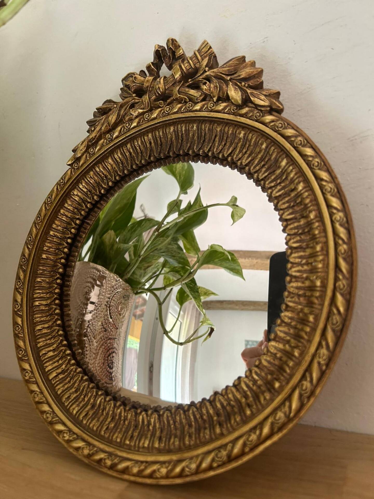Round golden convex mirror with mouldings - witch's mirror