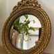 Round golden convex mirror with mouldings - witch's mirror