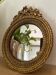 Round golden convex mirror with mouldings - witch's mirror