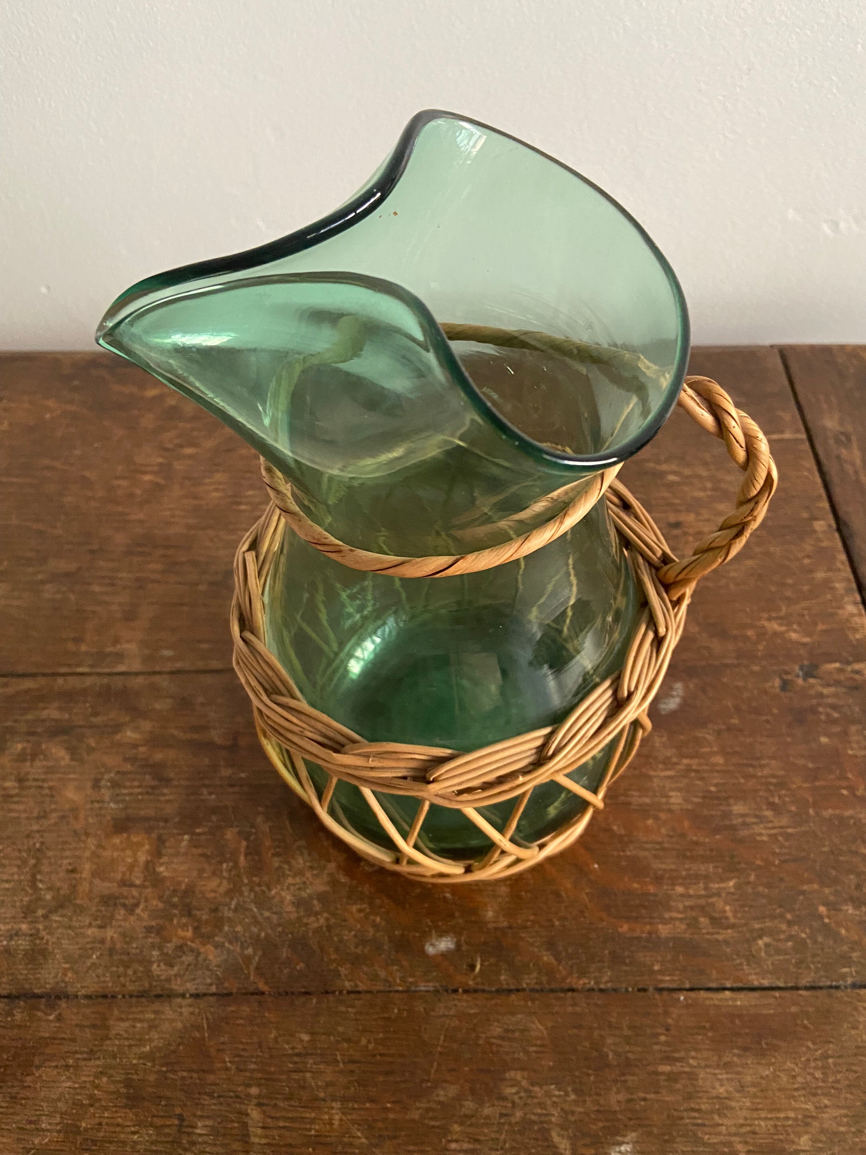 Glass pitcher and wicker