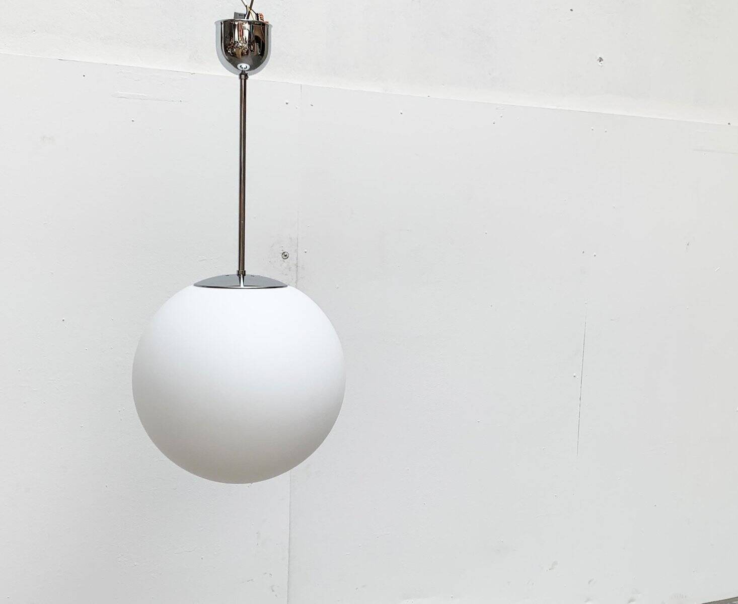 Vintage German space age glass ball pendant lamp by Limburg.
