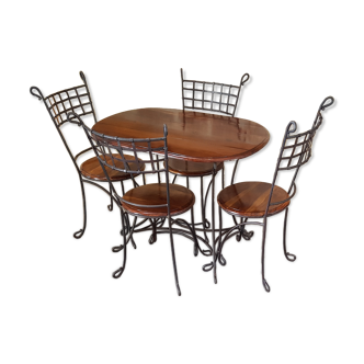 Table and chairs in wrought iron and wood