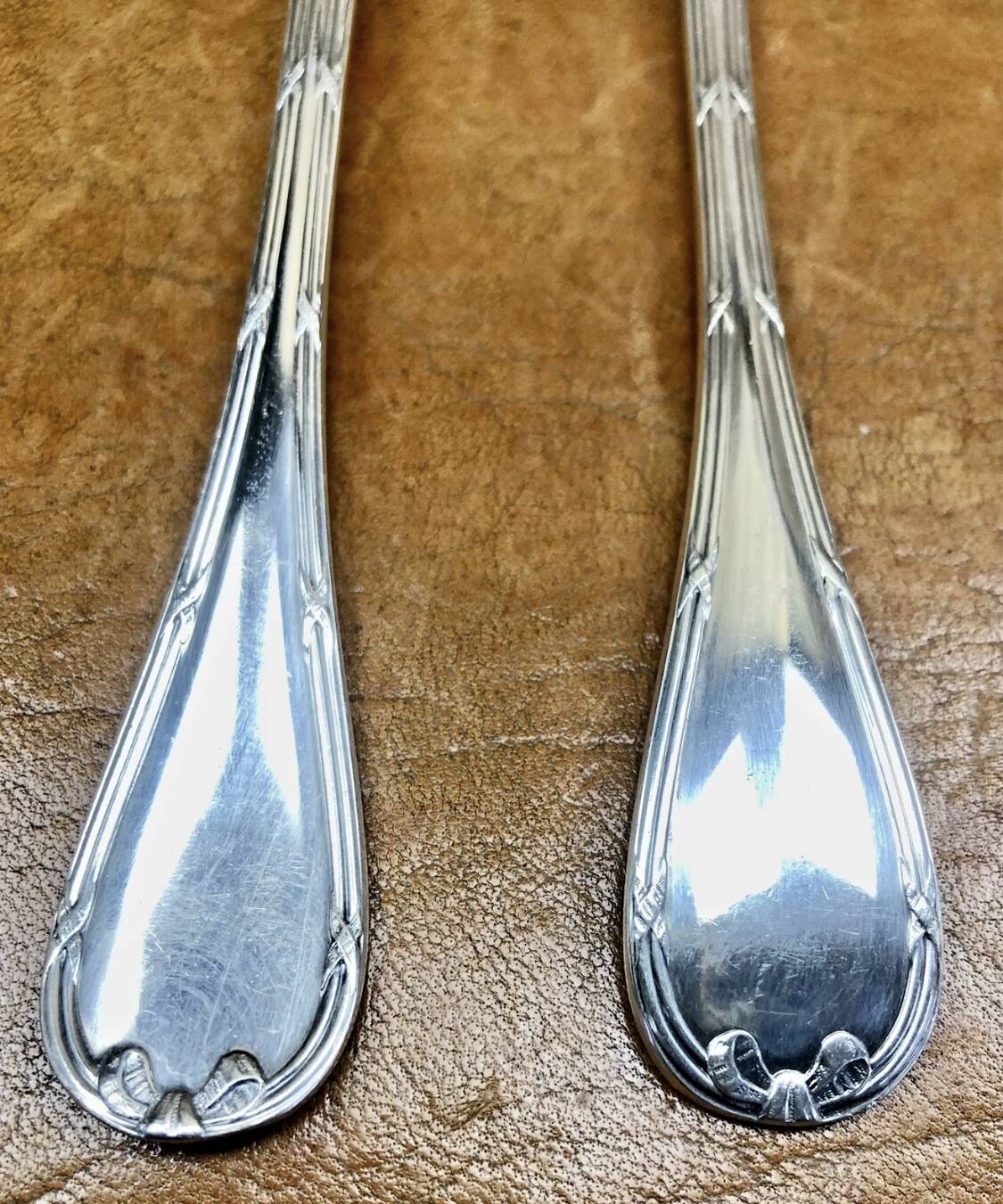7 Christofle silver-plated oyster forks with Louis crossed ribbons