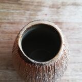 Small asymmetrical golden seed-shaped vase