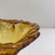 Amber-colored blown glass soliflore