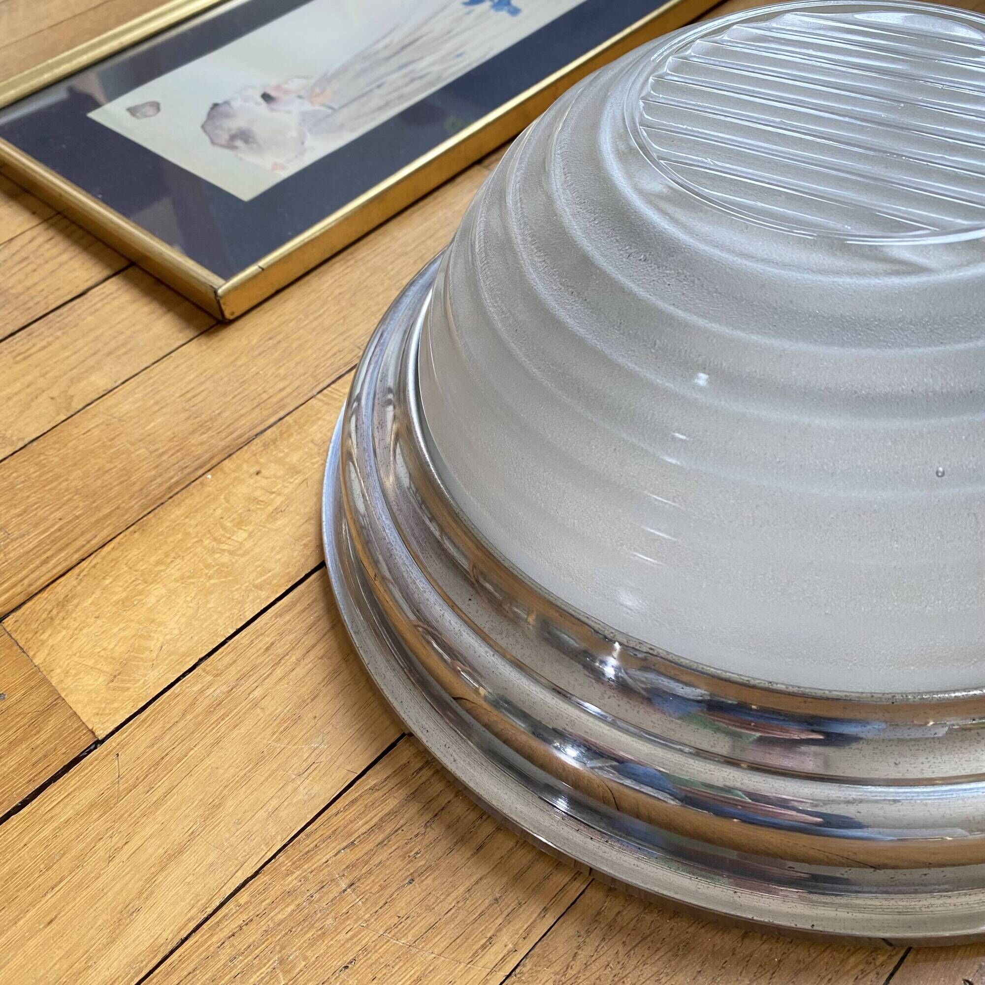 Thick glass ceiling light fixture with a chrome metal support, Holophane type.