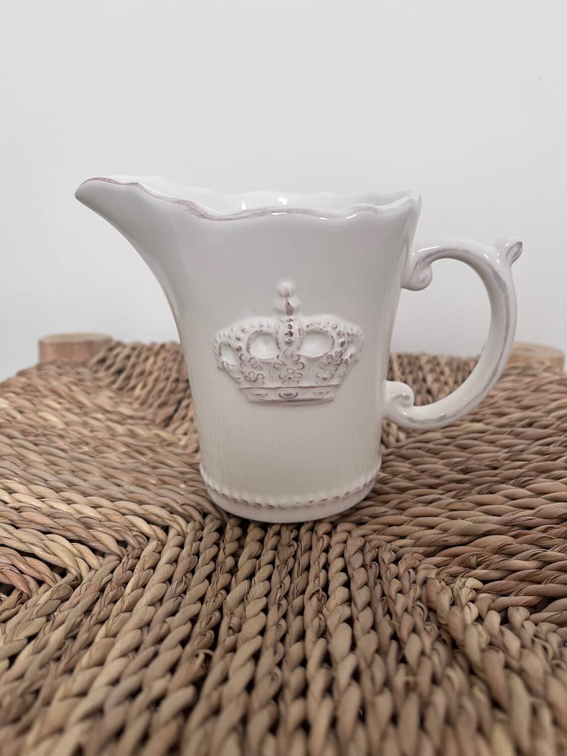 Small shabby white ceramic pitcher – crown motif