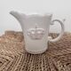 Small shabby white ceramic pitcher – crown motif