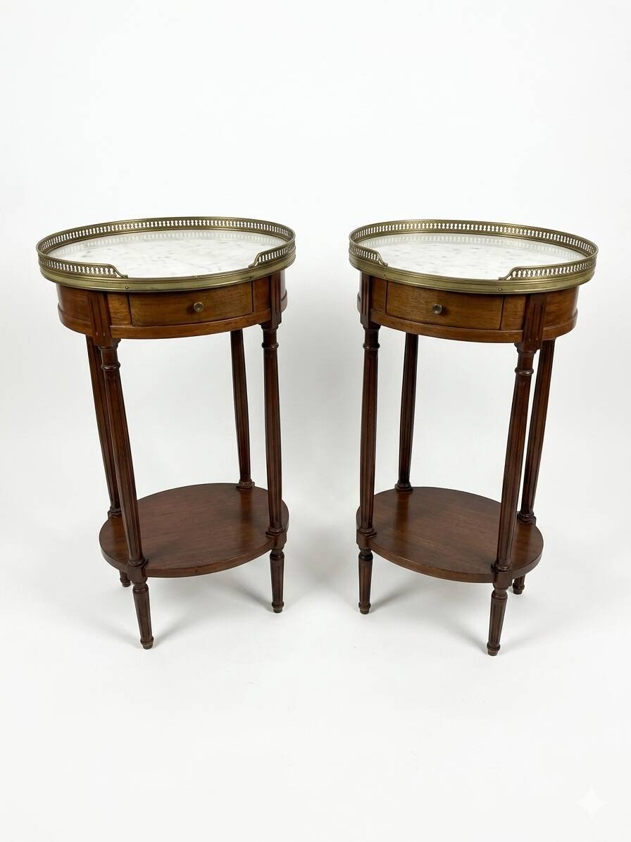 Pair of Louis XVI style bedside tables in mahogany, with marble tops.