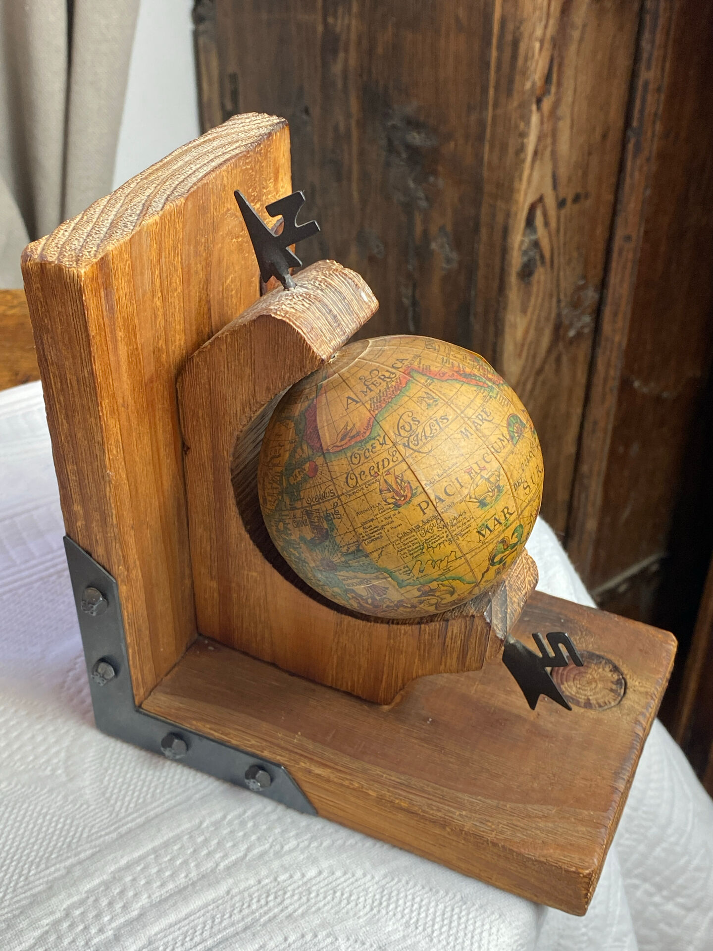 Pair of wooden bookends, rotating globes
