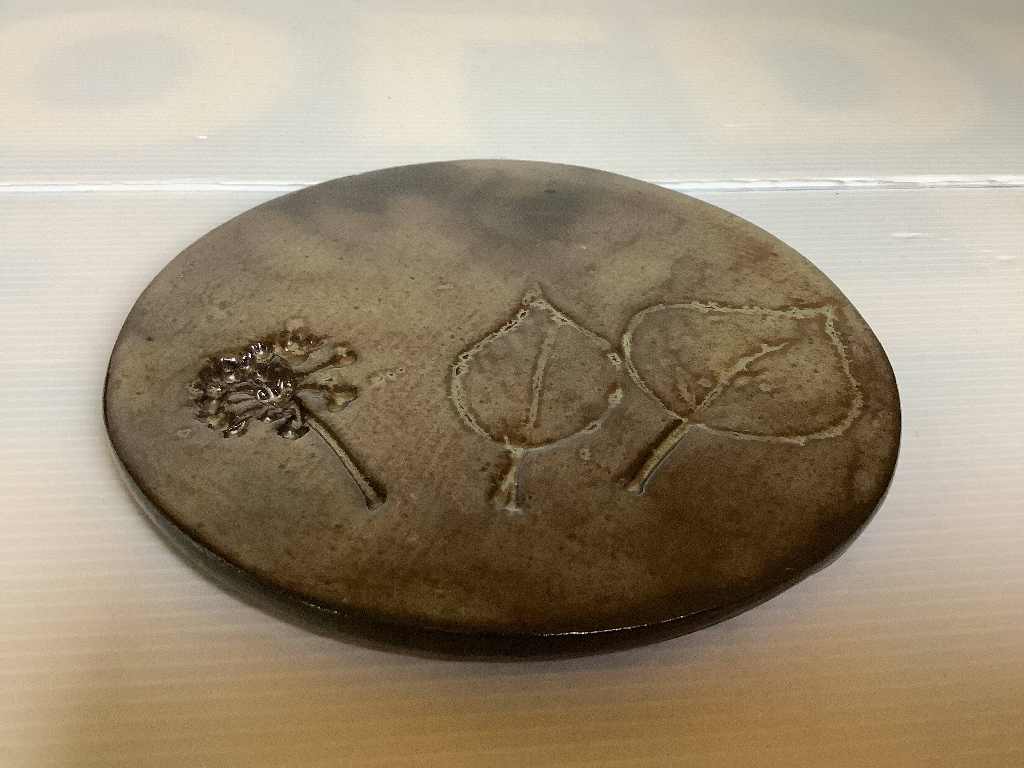 Brown ceramic trivet