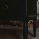 Black chest of drawers with 2 drawers, raw wood top and tapered legs