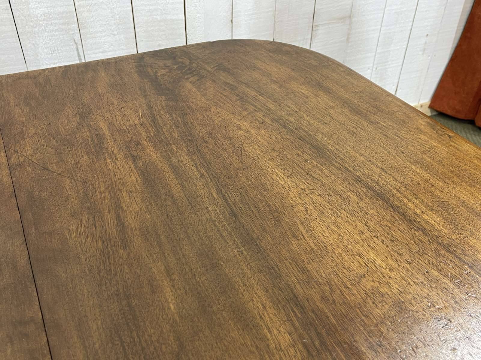 Henri II walnut table from the early 20th century with extensions.