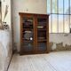 Glass-fronted walnut library 1900