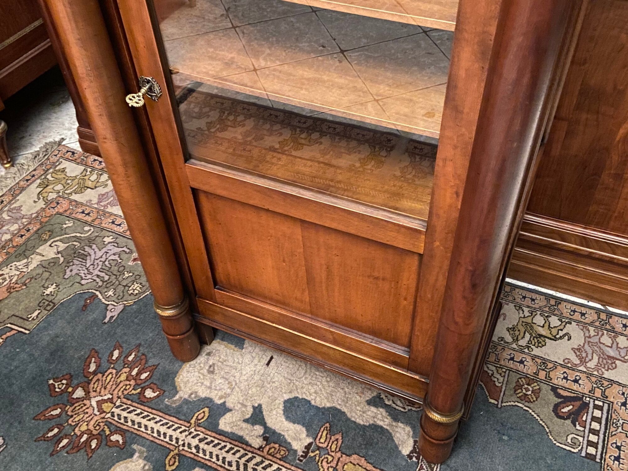 Empire style display case in cherry wood