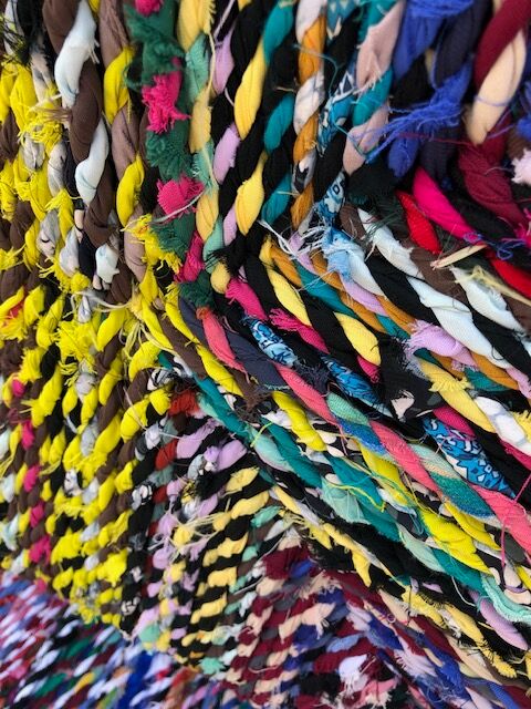 Wooden armchair braiding multicolored fabrics