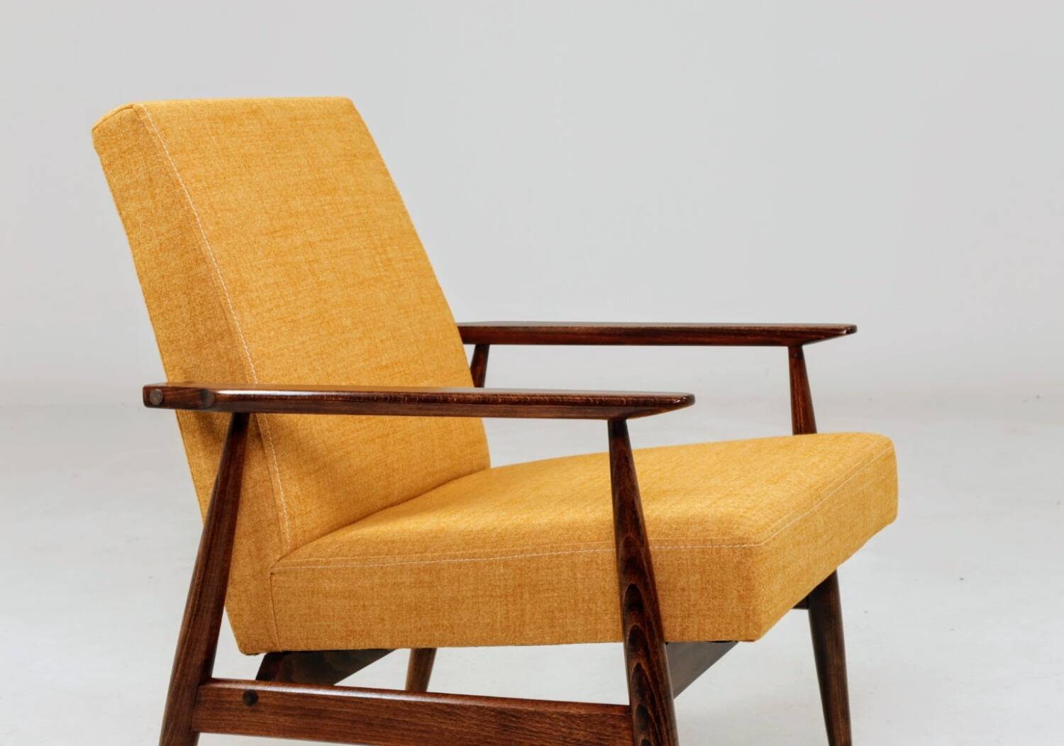 Vintage amber armchair Hermes designed by H. Lis