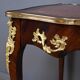Rosewood, mahogany, and rosewood desk-table, Louis XV style – early 20th century.