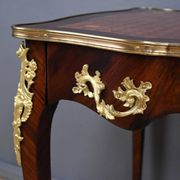 Rosewood, mahogany, and rosewood desk-table, Louis XV style – early 20th century.