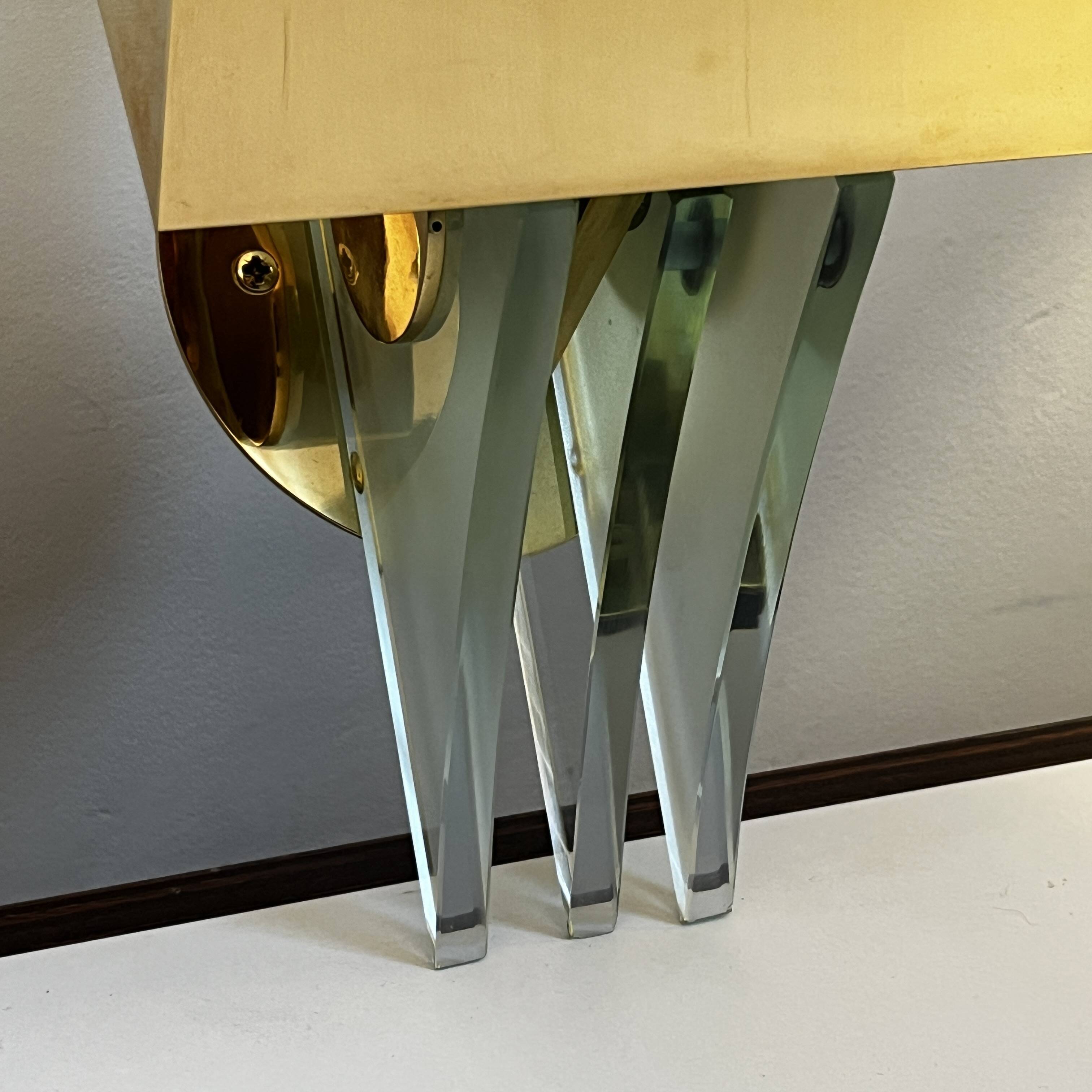 Pair of Hollywood Regency wall lights, bases & reflectors in gilded brass