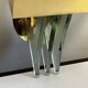 Pair of Hollywood Regency wall lights, bases & reflectors in gilded brass