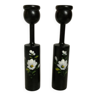 Pair of black wooden candlesticks with flowers