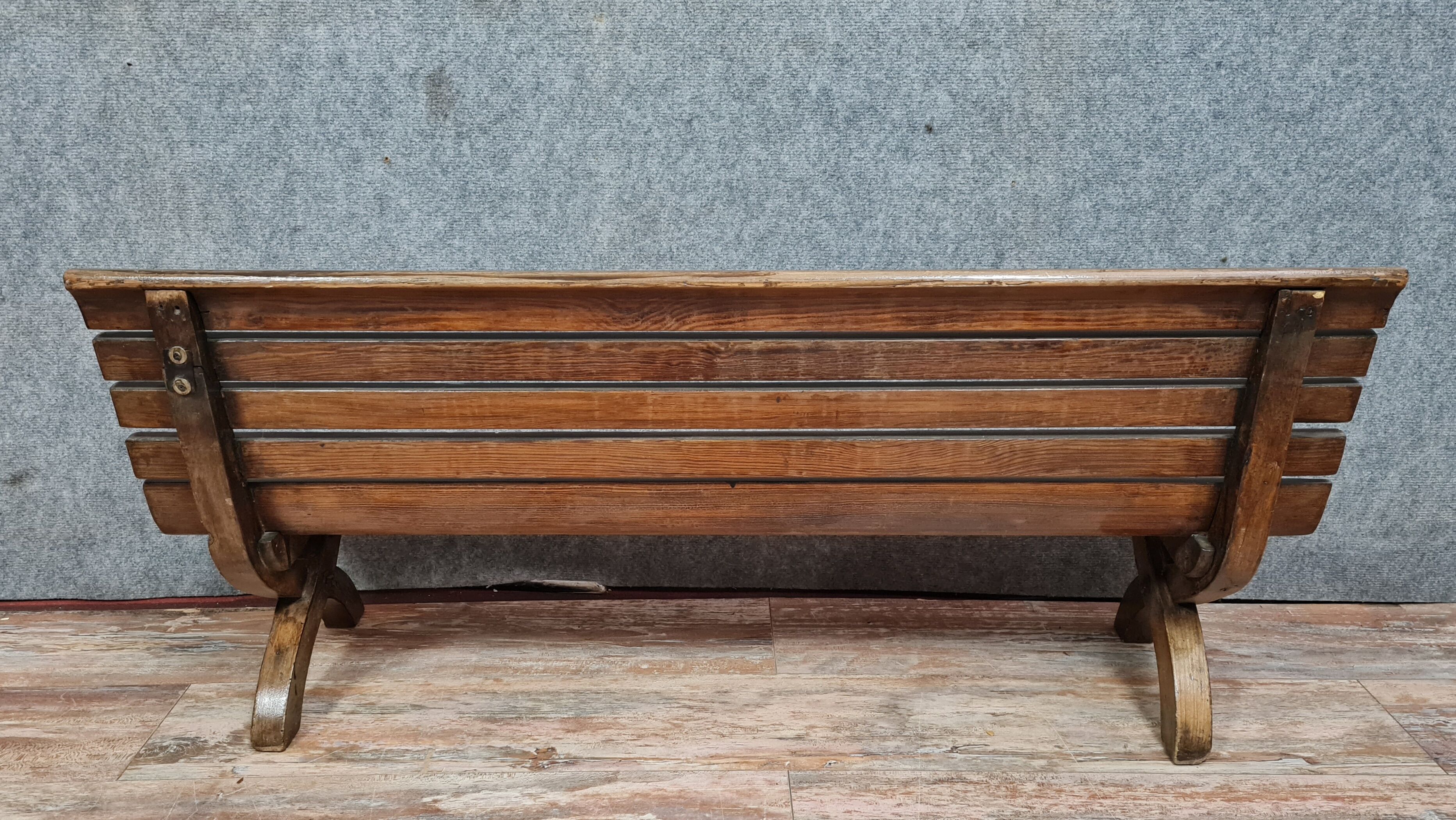Park bench and garden with natural wood backrest xixth century