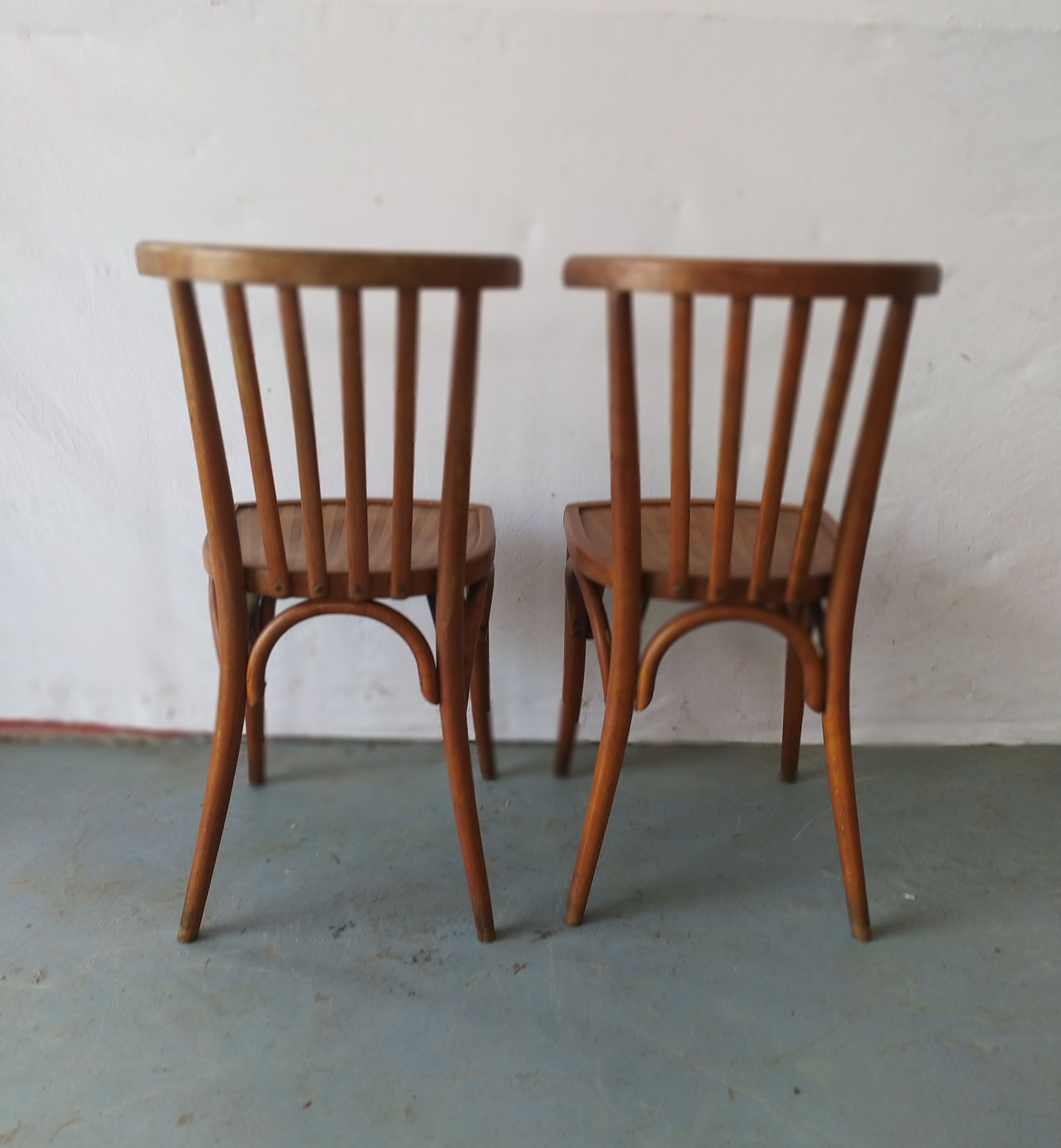Pair of luterma curved wood bistro chairs