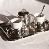 Silver-plated metal coffee service with a grape design.