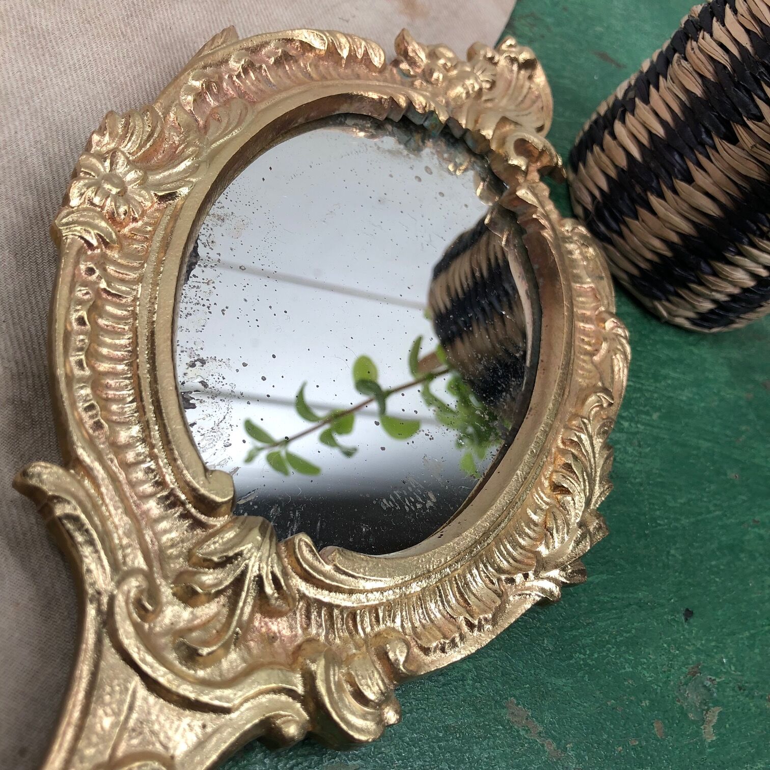 Bronze "face to hand" mirror
