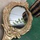 Miroir "face à main" en bronze