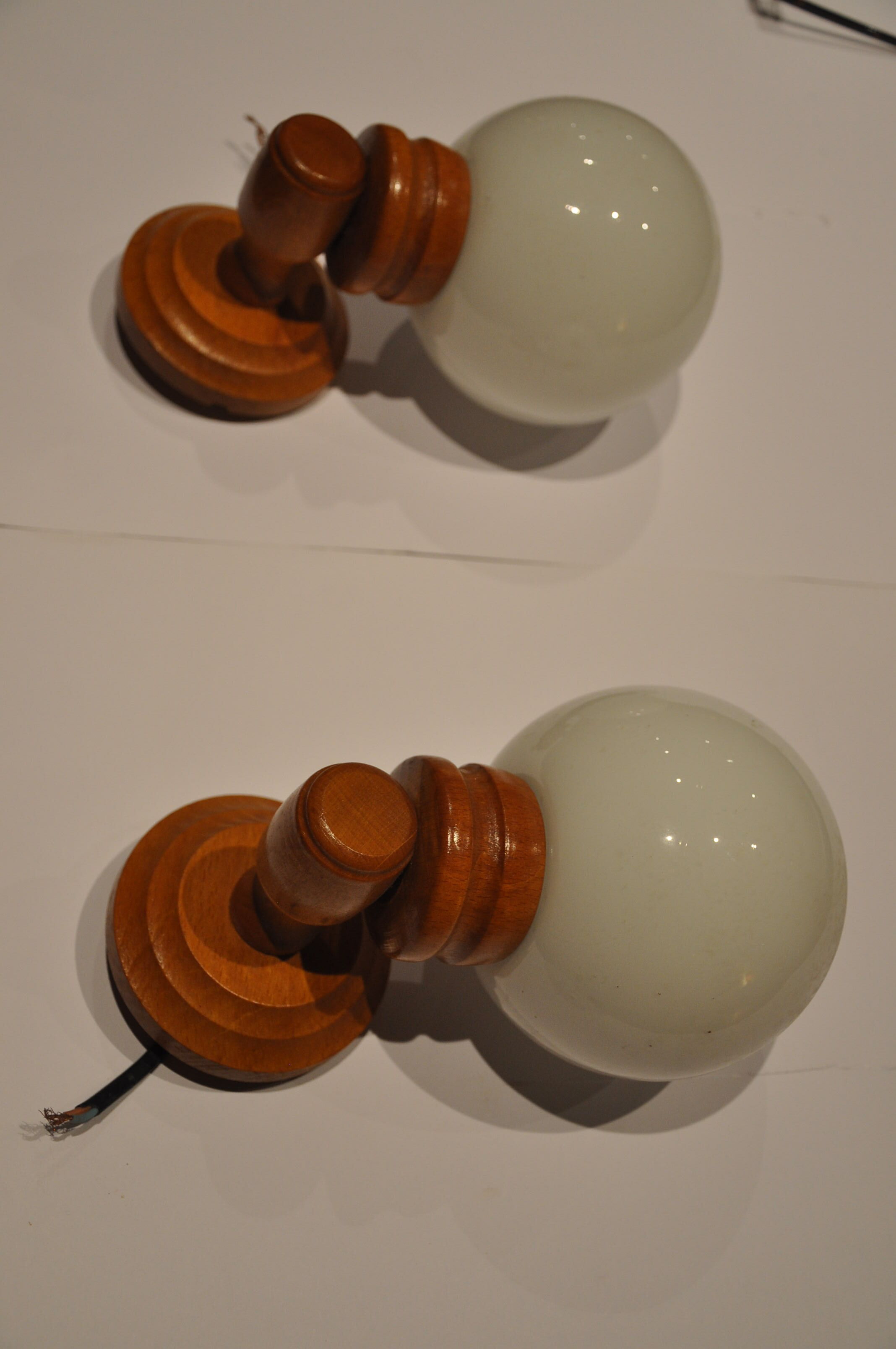 Duo of wooden wall light and glass globes