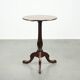 Round antique side/wine table from the late 18th century with a subtle foot