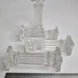 Set of four glass covered doors in the shape of Corinthian columns