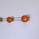 Vintage orange triple coat hook — metal and lacquered discs from the 60s/70s