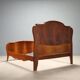 Antique baroque double bed in walnut and mahogany, 20th century.