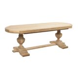 Large oval table in raw wood