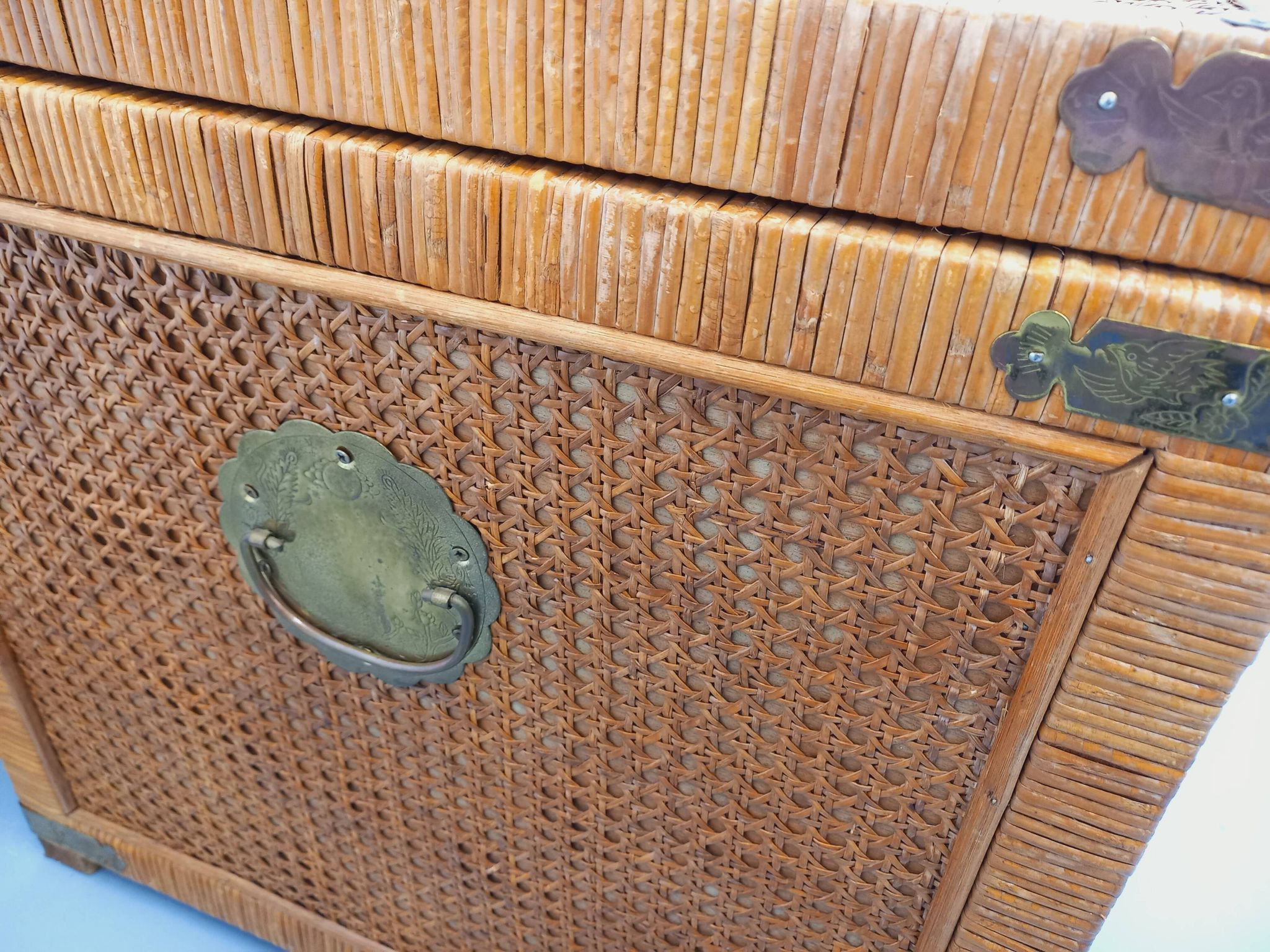Vintage trunk in wood, rattan, caning, and brass.