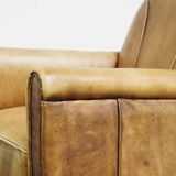 Unique children’s armchair made of cowhide leather in Art Deco style, featuring a light cognac color